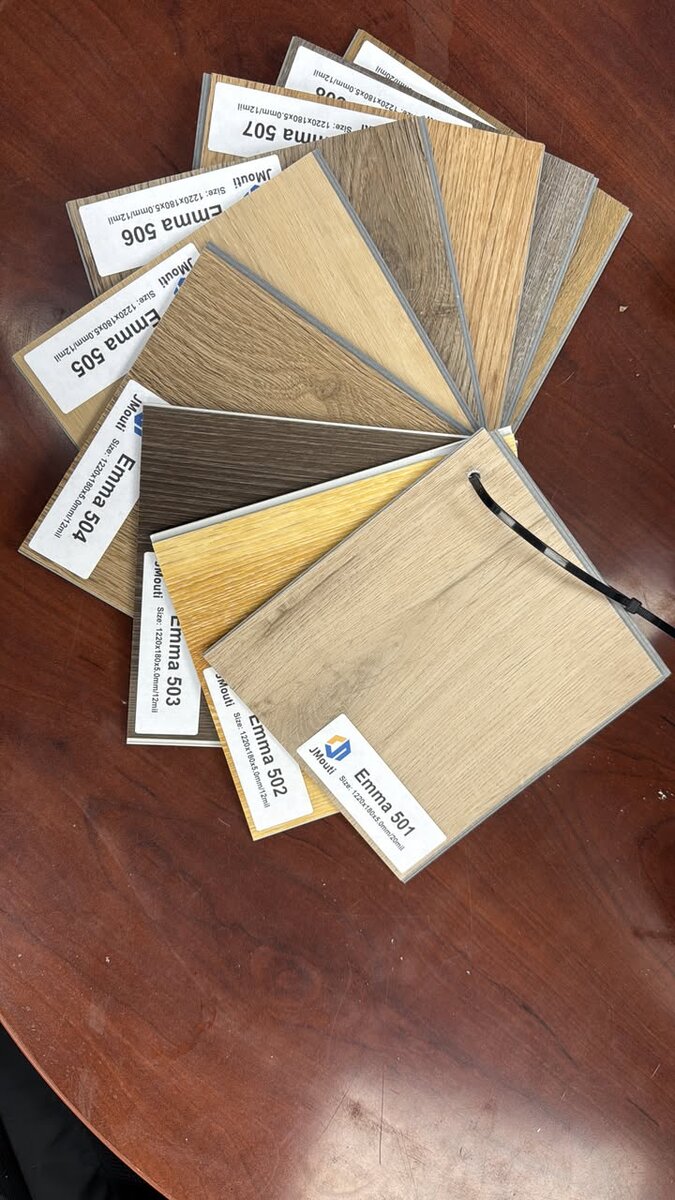 Continuous wood flooring connecting kitchen and living areas