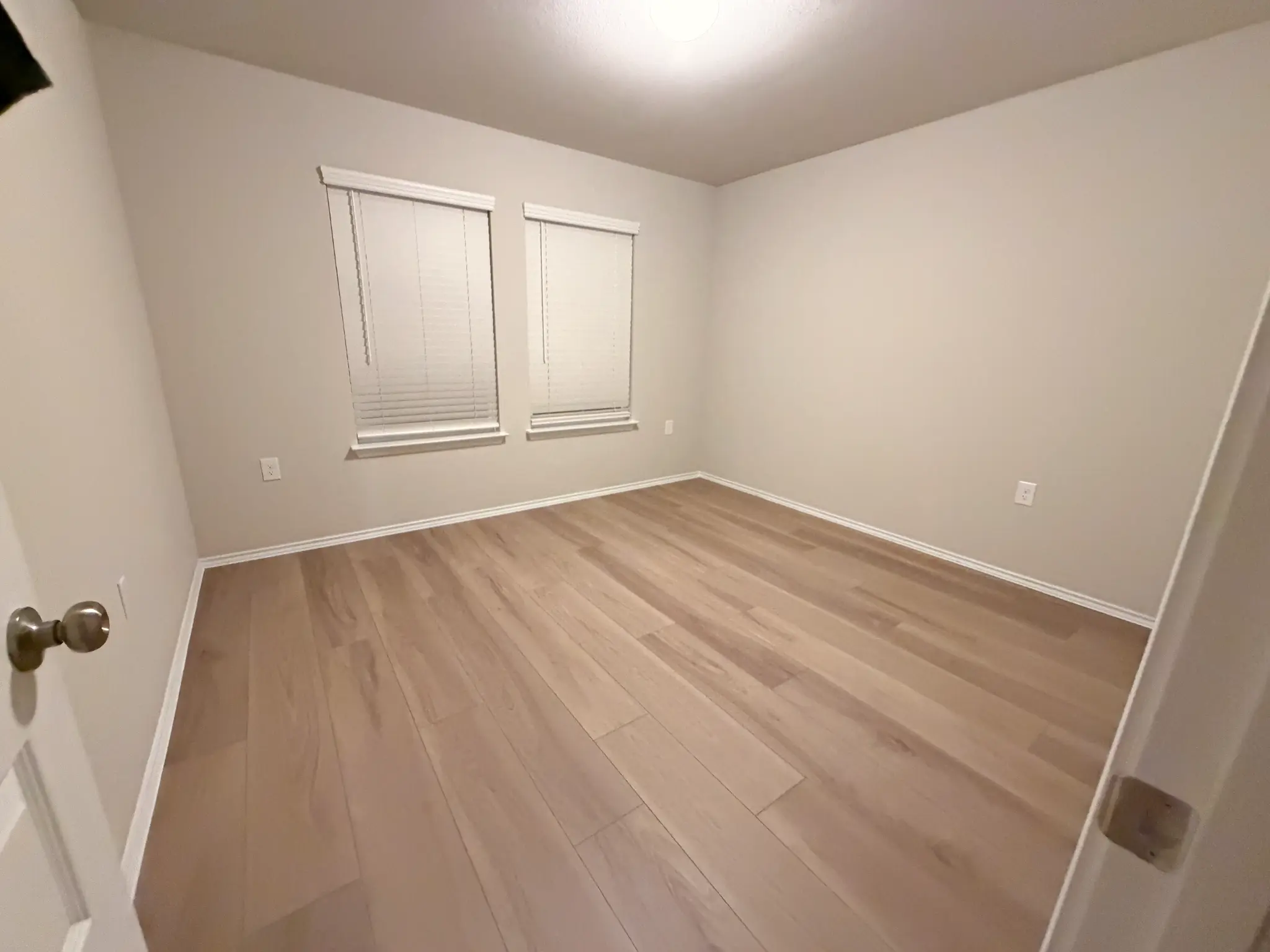 LVP flooring in open plan Austin living room with fireplace